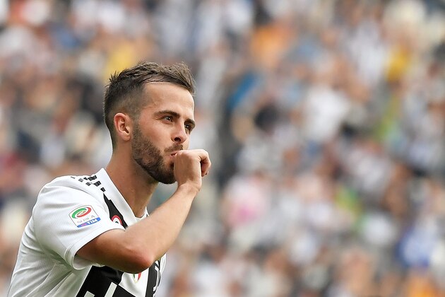 Juventus' midfielder Miralem Pjanic of Bosnia-Erzegovina celebrates after scoring during the Italian Serie A football match Juventus versus Verona, on May 19, 2018 at the Allianz Stadium in Turin. (Photo by MARCO BERTORELLO / AFP)        (Photo credit should read MARCO BERTORELLO/AFP/Getty Images)