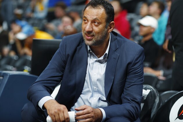 Sacramento Kings general manager Vlade Divac looks on from the bench as his team warms up before facing the Denver Nuggets in an NBA basketball game Saturday, Oct. 21, 2017, in Denver. (AP Photo/David Zalubowski)