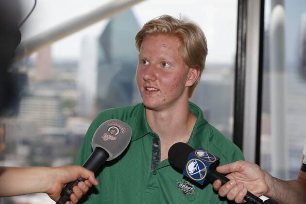 Rasmus Dahlin, of Sweden, talks to the media in Dallas, Thursday, June 21, 2018. The NHL hockey draft takes place Friday and Saturday in Dallas. (AP Photo/Michael Ainsworth)