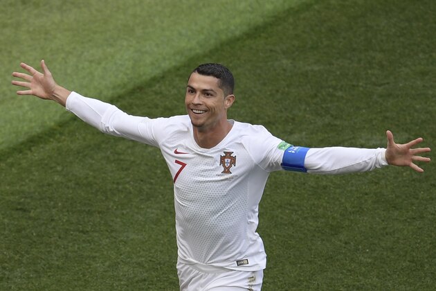TOPSHOT - Portugal's forward Cristiano Ronaldo celebrates his opening goal for Portugal during the Russia 2018 World Cup Group B football match between Portugal and Morocco at the Luzhniki Stadium in Moscow on June 20, 2018. (Photo by Juan Mabromata / AFP) / RESTRICTED TO EDITORIAL USE - NO MOBILE PUSH ALERTS/DOWNLOADS        (Photo credit should read JUAN MABROMATA/AFP/Getty Images)