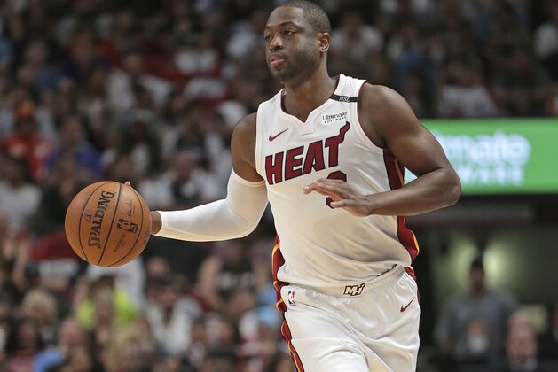 Miami Heat guard Dwyane Wade (3) brings the ball up court against the Chicago Bulls during the second half of an NBA basketball game, Thursday, March 29, 2018, in Miami. The Heat defeated the Bulls 103-92. (AP Photo/Joel Auerbach)