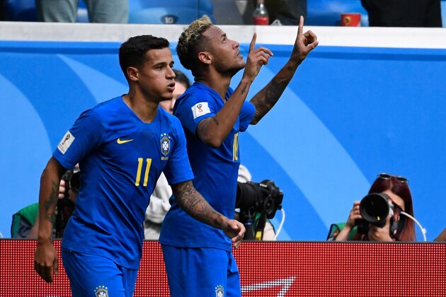 Brazil's forward Philippe Coutinho (L) congratulates Brazil's forward Neymar (R) for his goal during the Russia 2018 World Cup Group E football match between Brazil and Costa Rica at the Saint Petersburg Stadium in Saint Petersburg on June 22, 2018. (Photo by CHRISTOPHE SIMON / AFP) / RESTRICTED TO EDITORIAL USE - NO MOBILE PUSH ALERTS/DOWNLOADS        (Photo credit should read CHRISTOPHE SIMON/AFP/Getty Images)
