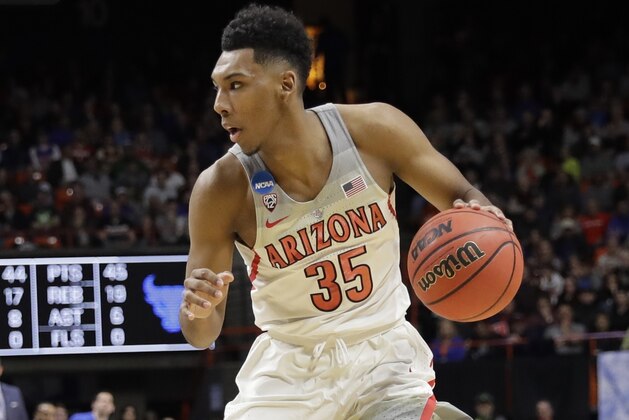Arizona guard Allonzo Trier (35) dribbles against Buffalo during the second half of a first-round game in the NCAA men's college basketball tournament Thursday, March 15, 2018, in Boise, Idaho. Buffalo won 89-68. (AP Photo/Otto Kitsinger)