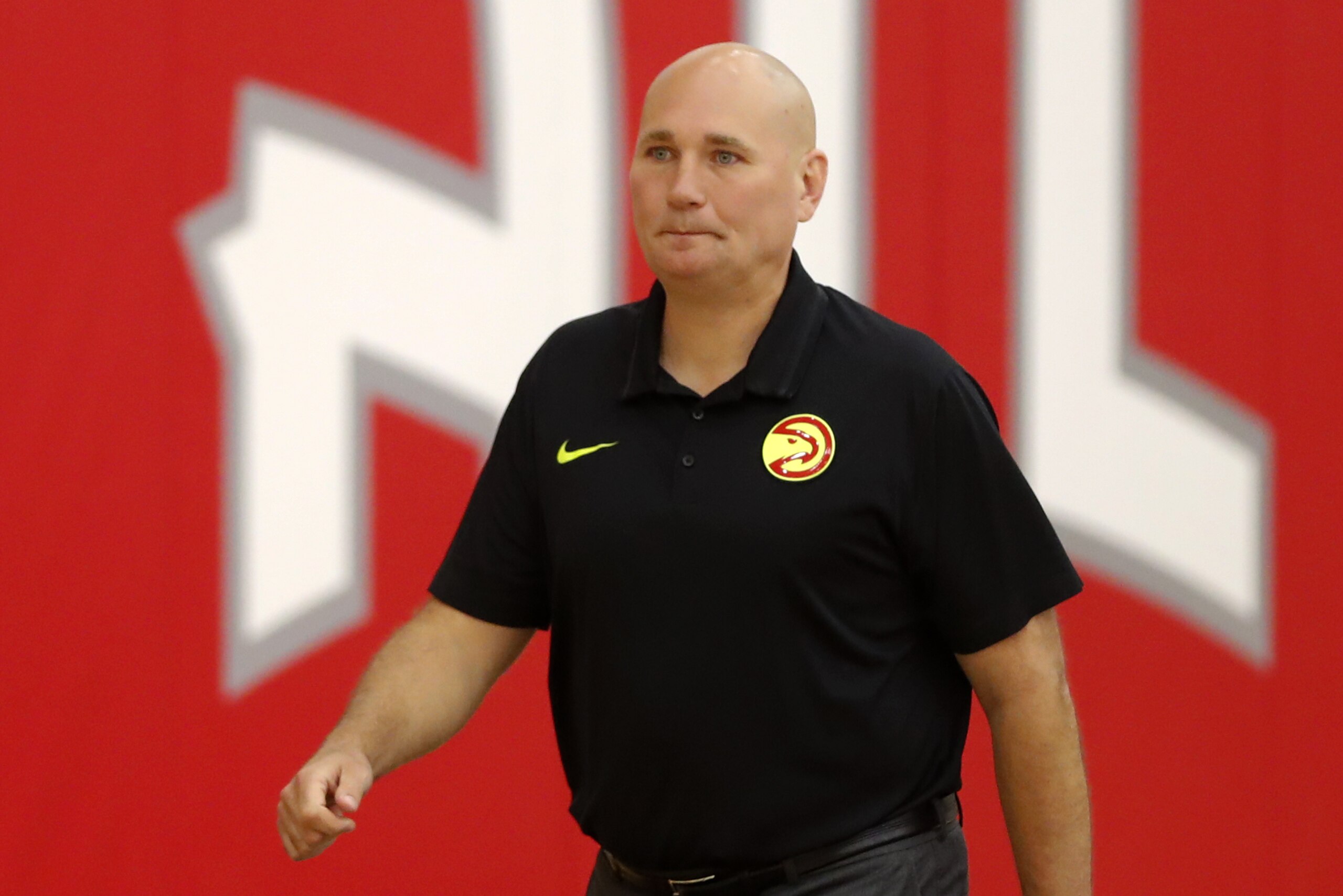 Atlanta Hawks general manager and head of basketball operations Travis Schlenk prepares to speak to reporters after it was announced the team and head basketball coach Mike Budenholzer have decided to part ways Thursday, April 26, 2018, in Atlanta. (AP Photo/John Bazemore)