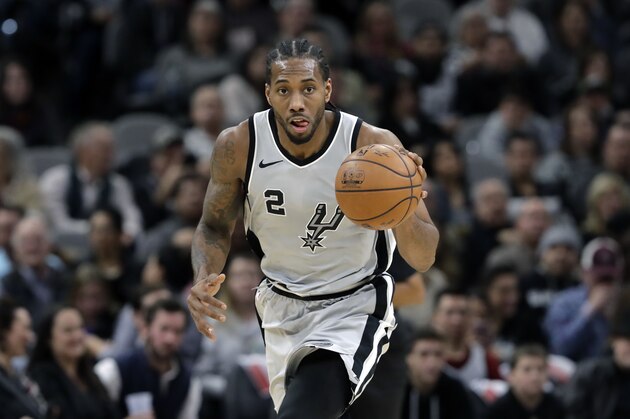 San Antonio Spurs forward Kawhi Leonard (2) moves the ball up court during the second half of an NBA basketball game against the Denver Nuggets, Saturday, Jan. 13, 2018, in San Antonio. San Antonio won 112-80. (AP Photo/Eric Gay)