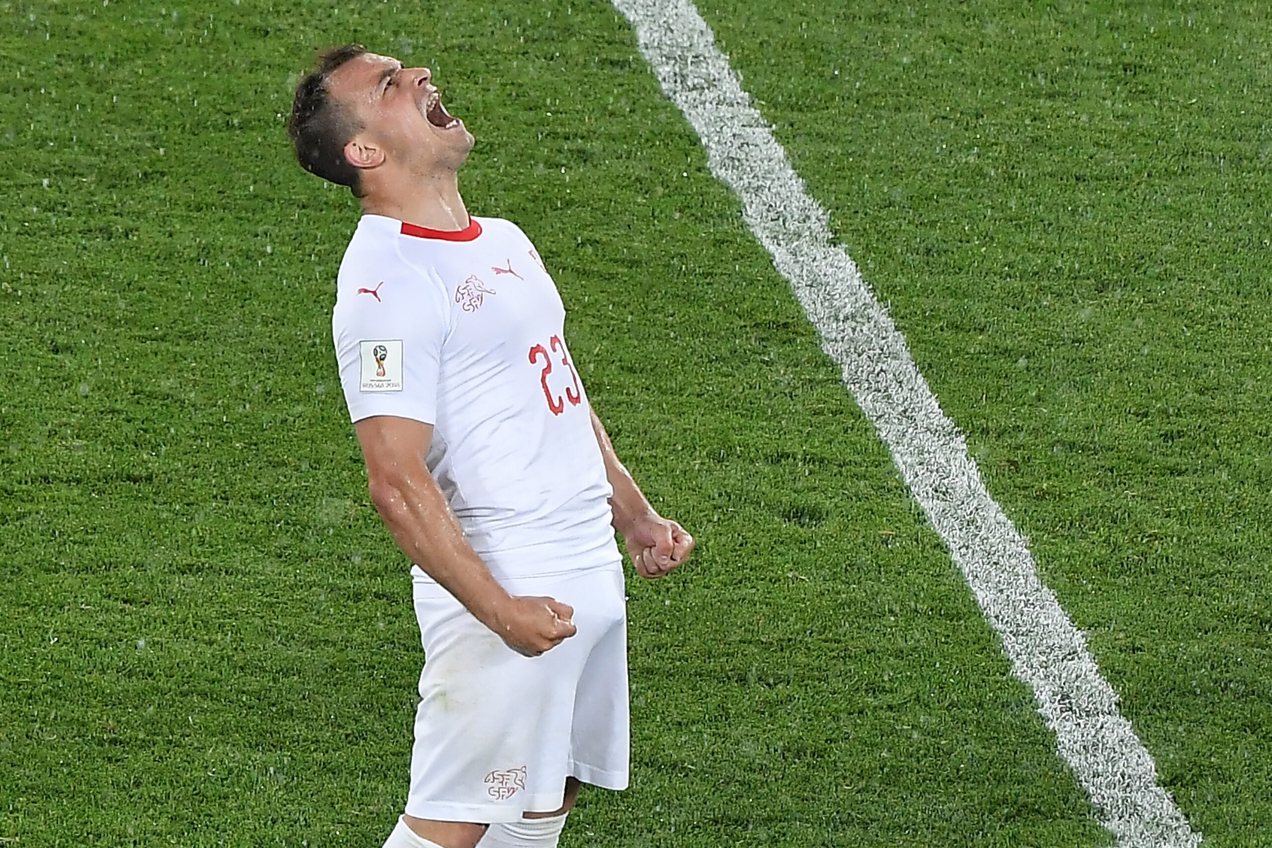 TOPSHOT - Switzerland's forward Xherdan Shaqiri celebrates after winning the Russia 2018 World Cup Group E football match between Serbia and Switzerland at the Kaliningrad Stadium in Kaliningrad on June 22, 2018. (Photo by Patrick HERTZOG / AFP) / RESTRICTED TO EDITORIAL USE - NO MOBILE PUSH ALERTS/DOWNLOADS        (Photo credit should read PATRICK HERTZOG/AFP/Getty Images)