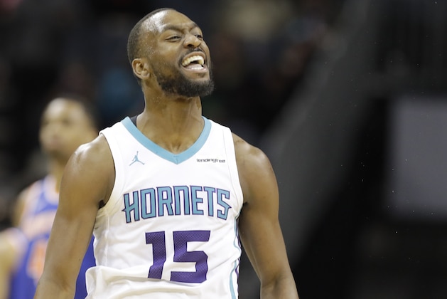 Charlotte Hornets' Kemba Walker (15) reacts after making a 3-point basket against the New York Knicks during overtime of an NBA basketball game in Charlotte, N.C., Monday, March 26, 2018. (AP Photo/Chuck Burton)