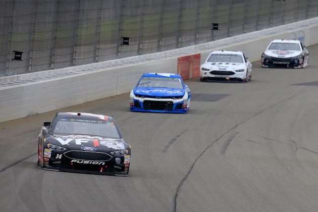 BROOKLYN, MI - JUNE 10: Clint Bowyer, driver of the #14 Haas 30 Years of the VF1 Ford, leads a pack of cars during the Monster Energy NASCAR Cup Series FireKeepers Casino 400 at Michigan International Speedway on June 10, 2018 in Brooklyn, Michigan.  (Photo by Daniel Shirey/Getty Images)