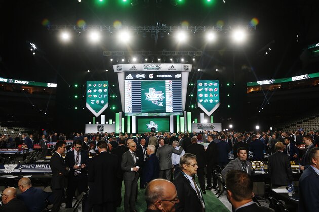 League and team officials are seen before the NHL hockey draft in Dallas, Friday, June 22, 2018. (AP Photo/Michael Ainsworth)