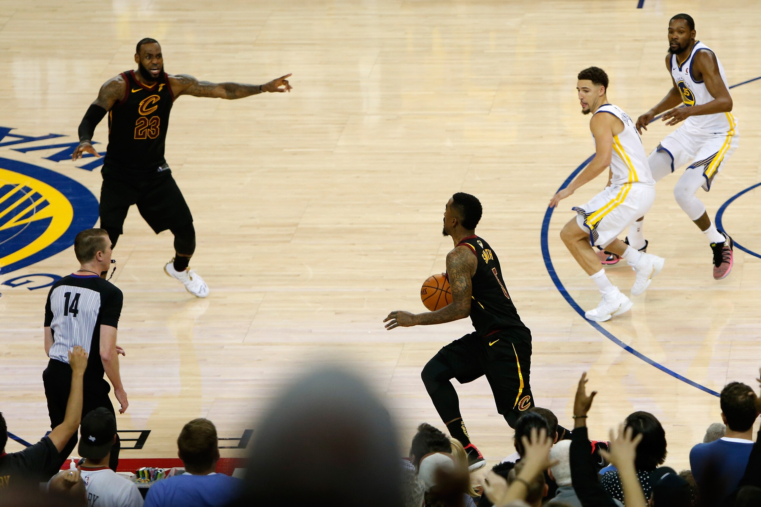 OAKLAND, CA - MAY 31:  JR Smith #5 of the Cleveland Cavaliers dribbles in the closing seconds of regulation as LeBron James #23 attempts direct the offense against the Golden State Warriors  in Game 1 of the 2018 NBA Finals at ORACLE Arena on May 31, 2018 in Oakland, California. NOTE TO USER: User expressly acknowledges and agrees that, by downloading and or using this photograph, User is consenting to the terms and conditions of the Getty Images License Agreement.  (Photo by Lachlan Cunningham/Getty Images)