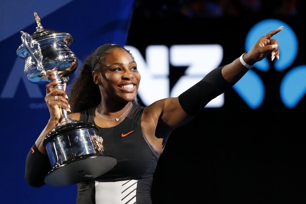 FILE - In this Saturday, Jan. 28, 2017, file photo, United States' Serena Williams holds her trophy after defeating her sister Venus during the women's singles final at the Australian Open tennis championships in Melbourne, Australia. Unbeknownst to fans and foes, Serena Williams was two months pregnant when she won the 2017 Australian Open. Williams is expected to have a strong 2018. (AP Photo/Dita Alangkara, File)