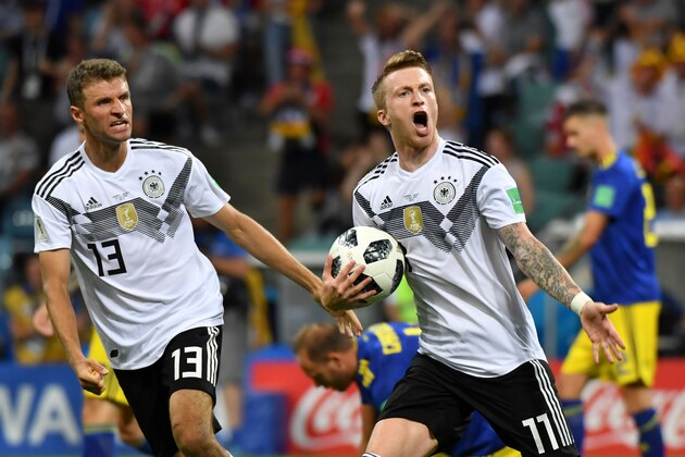TOPSHOT - Germany's forward Marco Reus celebrates scoring the 1-1 goal with Germany's forward Thomas Mueller (L) during the Russia 2018 World Cup Group F football match between Germany and Sweden at the Fisht Stadium in Sochi on June 23, 2018. (Photo by Nelson Almeida / AFP) / RESTRICTED TO EDITORIAL USE - NO MOBILE PUSH ALERTS/DOWNLOADS        (Photo credit should read NELSON ALMEIDA/AFP/Getty Images)