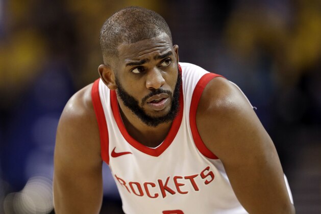 FILE - In this Tuesday, May 22, 2018, file photo, Houston Rockets' Chris Paul watches during the second half in Game 4 of the NBA basketball Western Conference Finals against the Golden State Warriors in Oakland, Calif. The Rockets will be without star guard Chris Paul for Game 6 because of a strained hamstring, a huge blow for a team trying to close out the Warriors. (AP Photo/Marcio Jose Sanchez, File)