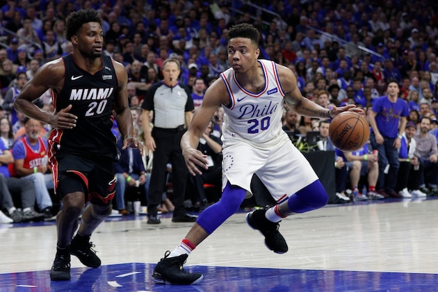 Philadelphia 76ers' Markelle Fultz, right, in action against Miami Heat's Justise Winslow, left, during the second half in Game 1 of a first-round NBA basketball playoff series, Saturday, April 14, 2018, in Philadelphia. The 76ers won 130-103. (AP Photo/Chris Szagola)