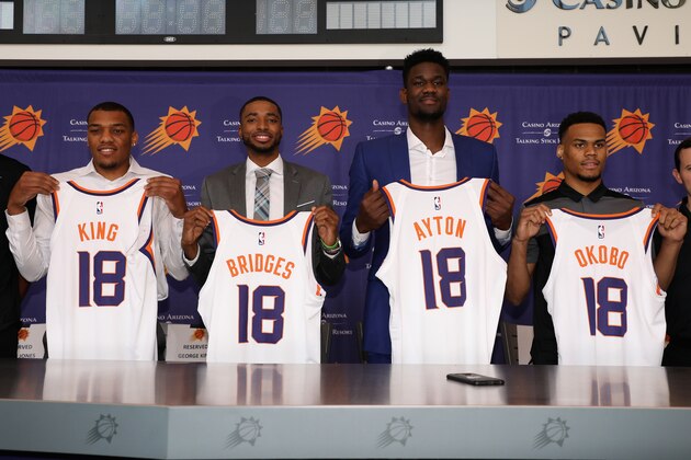 PHOENIX, AZ - JUNE 22:  (L-R)  George King, Mikal Bridges, Deandre Ayton, and Elie Okoo of the Pheonix Suns pose together following press conference at Talking Stick Resort Arena on June 22, 2018 in Phoenix, Arizona.  NOTE TO USER: User expressly acknowledges and agrees that, by downloading and or using this photograph, User is consenting to the terms and conditions of the Getty Images License Agreement.  (Photo by Christian Petersen/Getty Images)