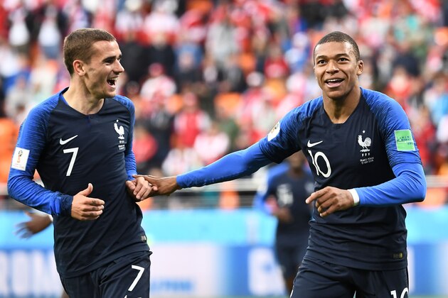 TOPSHOT - France's forward Kylian Mbappe (R) celebrates scoring the opening goal with his teammate forward Antoine Griezmann during the Russia 2018 World Cup Group C football match between France and Peru at the Ekaterinburg Arena in Ekaterinburg on June 21, 2018. (Photo by Anne-Christine POUJOULAT / AFP) / RESTRICTED TO EDITORIAL USE - NO MOBILE PUSH ALERTS/DOWNLOADS        (Photo credit should read ANNE-CHRISTINE POUJOULAT/AFP/Getty Images)