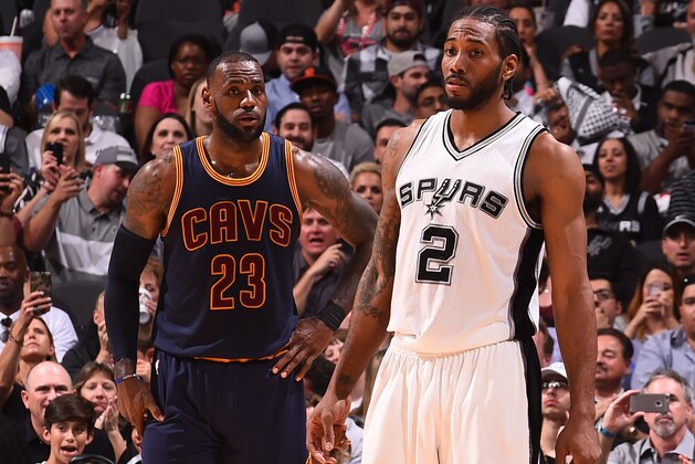 SAN ANTONIO, TX - MARCH 27:  LeBron James #23 of the Cleveland Cavaliers and Kawhi Leonard #2 of the San Antonio Spurs stand on the court during a game on March 27, 2017 at the AT&T Center in San Antonio, Texas. NOTE TO USER: User expressly acknowledges and agrees that, by downloading and or using this photograph, user is consenting to the terms and conditions of the Getty Images License Agreement. Mandatory Copyright Notice: Copyright 2017 NBAE (Photos by Noah Graham/NBAE via Getty Images)