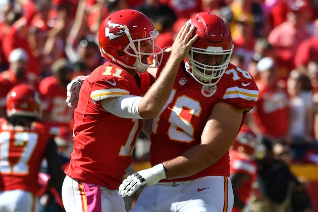 KANSAS CITY, MO - OCTOBER 23: Quarterback Alex Smith #11 of the Kansas City Chiefs celebrates a touchdown pass with Laurent Duvernay-Tardif #76 at Arrowhead Stadium during the second quarter of the game against the New Orleans Saints on October 23, 2016 in Kansas City, Missouri. (Photo by Peter Aiken/Getty Images)
