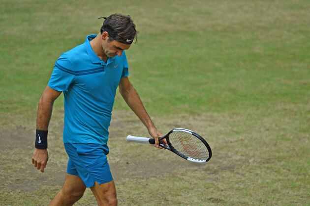 HALLE, GERMANY - JUNE 24: Roger Federer of Switzerland looks dejected in the final match against Borna Coric of Croatia during day seven of the Gerry Weber Open at Gerry Weber Stadium on June 24, 2018 in Halle, Germany. (Photo by Thomas Starke/Getty Images)