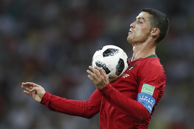 TOPSHOT - Portugal's forward Cristiano Ronaldo controls the ball during the Russia 2018 World Cup Group B football match between Portugal and Spain at the Fisht Stadium in Sochi on June 15, 2018. (Photo by Adrian DENNIS / AFP) / RESTRICTED TO EDITORIAL USE - NO MOBILE PUSH ALERTS/DOWNLOADS (Photo credit should read ADRIAN DENNIS/AFP/Getty Images) TOPSHOT - Portugal's forward Cristiano Ronaldo controls the ball during the Russia 2018 World Cup Group B football match between Portugal and Spain at the Fisht Stadium in Sochi on June 15, 2018. (Photo by Adrian DENNIS / AFP) / RESTRICTED TO EDITORIAL USE - NO MOBILE PUSH ALERTS/DOWNLOADS (Photo credit should read ADRIAN DENNIS/AFP/Getty Images)