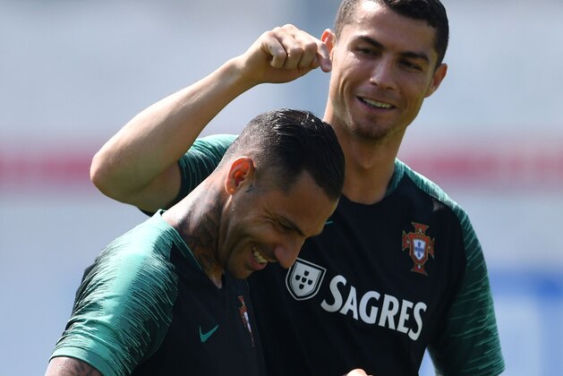 Portugal's forward Cristiano Ronaldo (R) shares a laugh with Portugal's forward Ricardo Quaresma during a training session, on June 23, 2018 at the team's training base in Kratovo, during Russia 2018 World Cup football tournament. (Photo by Francisco LEONG / AFP)        (Photo credit should read FRANCISCO LEONG/AFP/Getty Images)