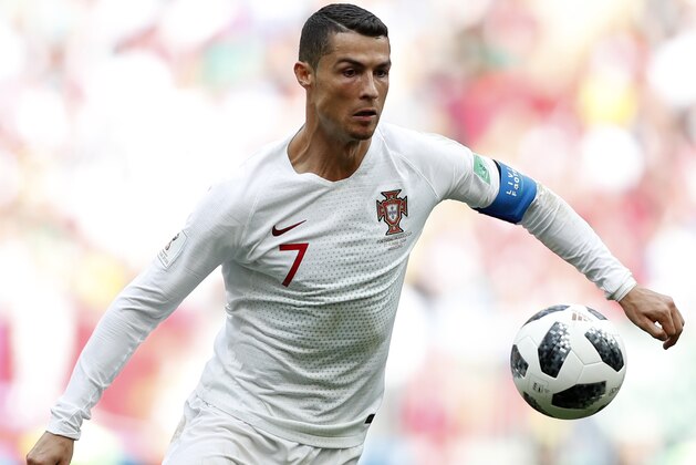 Portugal's Cristiano Ronaldo goes for the ball during the group B match between Portugal and Morocco at the 2018 soccer World Cup in the Luzhniki Stadium in Moscow, Russia, Wednesday, June 20, 2018. (AP Photo/Francisco Seco)