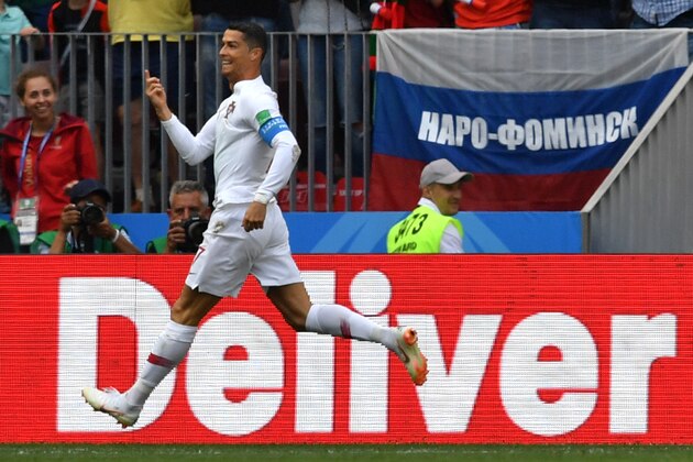 Portugal's forward Cristiano Ronaldo celebrates after scoring a goal during the Russia 2018 World Cup Group B football match between Portugal and Morocco at the Luzhniki Stadium in Moscow on June 20, 2018. (Photo by Yuri CORTEZ / AFP) / RESTRICTED TO EDITORIAL USE - NO MOBILE PUSH ALERTS/DOWNLOADS        (Photo credit should read YURI CORTEZ/AFP/Getty Images)