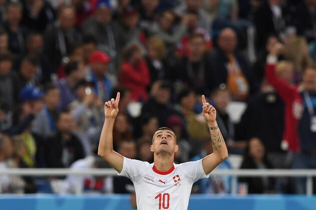 TOPSHOT - Switzerland's midfielder Granit Xhaka celebrates scoring during their Russia 2018 World Cup Group E football match between Serbia and Switzerland at the Kaliningrad Stadium in Kaliningrad on June 22, 2018. (Photo by Attila KISBENEDEK / AFP) / RESTRICTED TO EDITORIAL USE - NO MOBILE PUSH ALERTS/DOWNLOADS        (Photo credit should read ATTILA KISBENEDEK/AFP/Getty Images)
