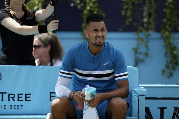 Australia's Nick Kyrgios looks on duringa break in his semifinal tennis match against Croatia's Marin Cilic at the Queen's Club tennis tournament in London, Saturday, June 23, 2018. (AP Photo/Tim Ireland)