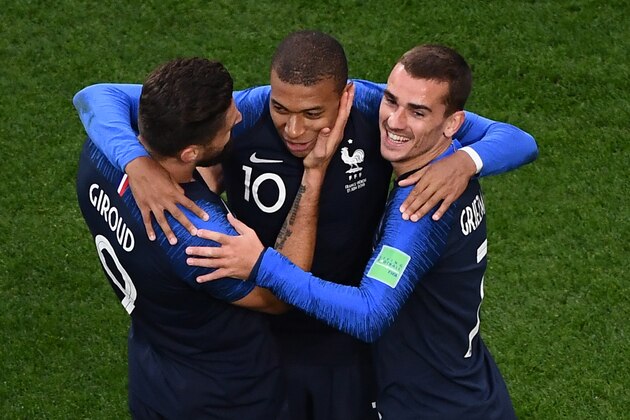 TOPSHOT - France's forward Kylian Mbappe (C) celebrates his goal with teammates Olivier Giroud (L) and Antoine Griezmann during the Russia 2018 World Cup Group C football match between France and Peru at the Ekaterinburg Arena in Ekaterinburg on June 21, 2018. (Photo by Jewel SAMAD / AFP) / RESTRICTED TO EDITORIAL USE - NO MOBILE PUSH ALERTS/DOWNLOADS        (Photo credit should read JEWEL SAMAD/AFP/Getty Images)