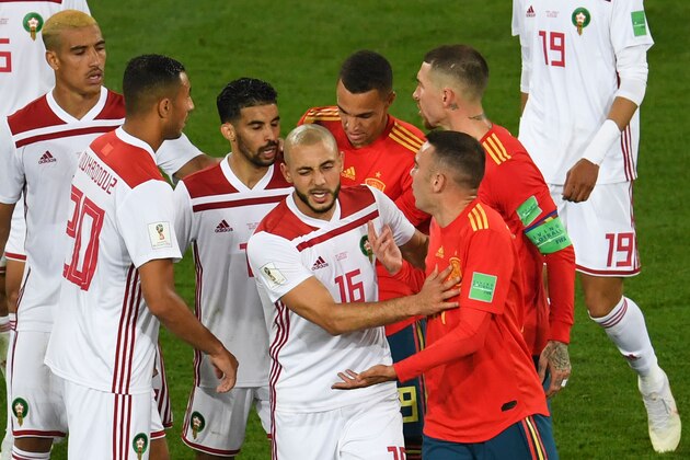 Morocco's forward Noureddine Amrabat (C) reacts as players clash during the Russia 2018 World Cup Group B football match between Spain and Morocco at the Kaliningrad Stadium in Kaliningrad on June 25, 2018. (Photo by OZAN KOSE / AFP) / RESTRICTED TO EDITORIAL USE - NO MOBILE PUSH ALERTS/DOWNLOADS        (Photo credit should read OZAN KOSE/AFP/Getty Images)