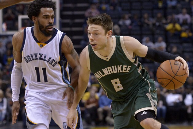Milwaukee Bucks guard Matthew Dellavedova (8) drives against Memphis Grizzlies guard Mike Conley (11) in the first half of an NBA basketball game Monday, March 13, 2017, in Memphis, Tenn. (AP Photo/Brandon Dill)