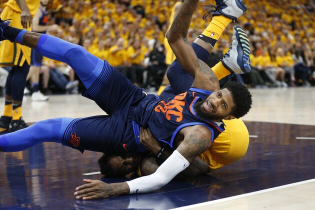 Utah Jazz forward Jae Crowder, bottom, fouls Oklahoma City Thunder forward Paul George, right, in the first half during Game 6 of an NBA basketball first-round playoff series Friday, April 27, 2018, in Salt Lake City. (AP Photo/Rick Bowmer)