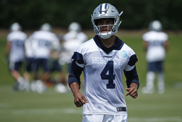 Dallas Cowboys quarterback Dak Prescott (4) takes the field during an organized team activity at its NFL football training facility in Frisco, Texas, Wednesday, May 23, 2018. (AP Photo/Ron Jenkins)