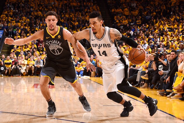 OAKLAND, CA - APRIL 16: Danny Green #14 of the San Antonio Spurs handles the ball against the Golden State Warriors in Game Two of Round One of the 2018 NBA Playoffs on April 16, 2018 at ORACLE Arena in Oakland, California. NOTE TO USER: User expressly acknowledges and agrees that, by downloading and or using this photograph, user is consenting to the terms and conditions of Getty Images License Agreement. Mandatory Copyright Notice: Copyright 2018 NBAE (Photo by Noah Graham/NBAE via Getty Images)