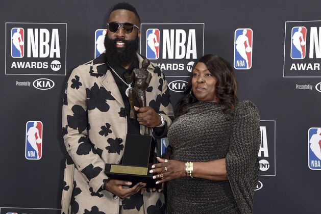 NBA player James Harden, of the Houston Rockets, left, winner of the most valuable player award, poses in the press room with his mother Monja Willis at the NBA Awards on Monday, June 25, 2018, at the Barker Hangar in Santa Monica, Calif. (Photo by Richard Shotwell/Invision/AP)