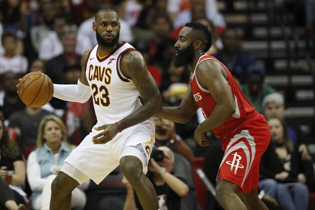 HOUSTON, TX - NOVEMBER 09:  LeBron James #23 of the Cleveland Cavaliers controls the ball against James Harden #13 of the Houston Rockets in the first half at Toyota Center on November 09, 2017 in Houston, Texas.  NOTE TO USER: User expressly acknowledges and agrees that, by downloading and or using this photograph, User is consenting to the terms and conditions of the Getty Images License Agreement.  (Photo by Tim Warner/Getty Images)