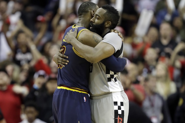 FILE - In this March 12, 2017, file photo, Cleveland Cavaliers' LeBron James, left, and Houston Rockets' James Harden hug after an NBA basketball game in Houston. For Cleveland's LeBron James, there was history. For Houston's James Harden, there was affirmation. James and Harden headlined the All-NBA first team that was unveiled Thursday, May 18, 2017. (AP Photo/David J. Phillip, File)