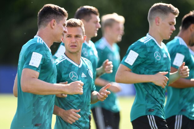 Germany's midfielder Joshua Kimmich talks to midfielder Mario Gomez (L) during a training session in Vatutinki on June 25, 2018, during the Russia 2018 World Cup football tournament. (Photo by Patrik STOLLARZ / AFP)        (Photo credit should read PATRIK STOLLARZ/AFP/Getty Images)
