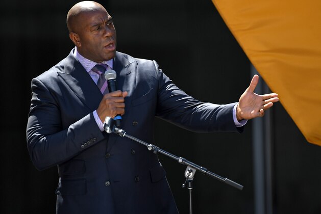LOS ANGELES, CA - APRIL 18:  Co-owner Magic Johnson of the Los Angeles FC speaks to fans and media at the ribbon cutting ceremony for the new Banc of California Stadium on April 18, 2018 in Los Angeles, California.  (Photo by Jayne Kamin-Oncea/Getty Images)
