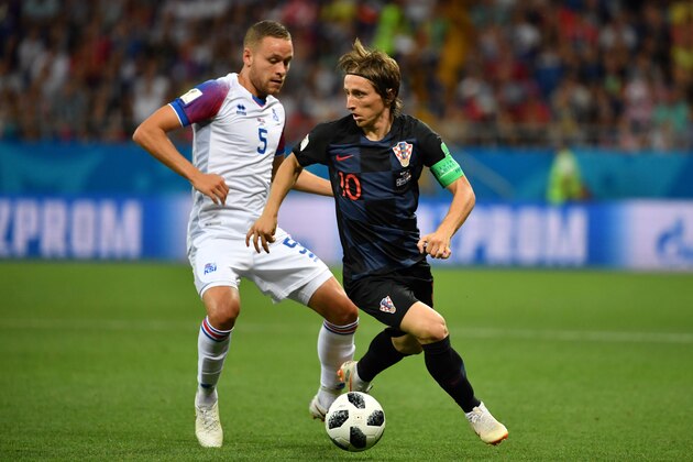 Iceland's defender Sverrir Ingason (L) vies with Croatia's midfielder Luka Modric during the Russia 2018 World Cup Group D football match between Iceland and Croatia at the Rostov Arena in Rostov-On-Don on June 26, 2018. (Photo by PASCAL GUYOT / AFP) / RESTRICTED TO EDITORIAL USE - NO MOBILE PUSH ALERTS/DOWNLOADS        (Photo credit should read PASCAL GUYOT/AFP/Getty Images)