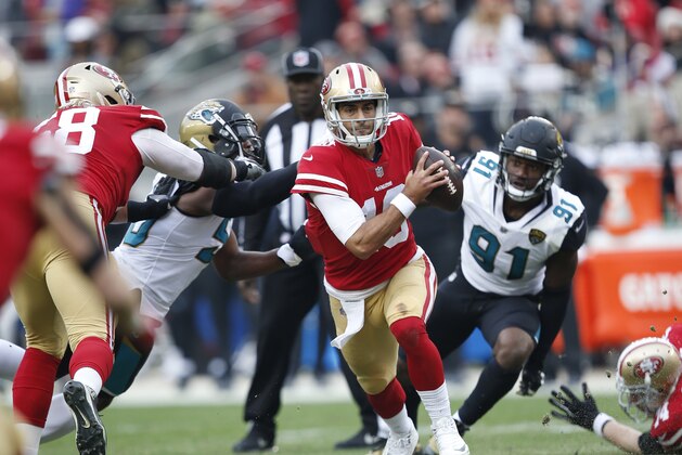 SANTA CLARA, CA - DECEMBER 24: Jimmy Garoppolo #10 of the San Francisco 49ers scrambles during the game against the Jacksonville Jaguars at Levi's Stadium on December 24, 2017 in Santa Clara, California. The 49ers defeated the Jaguars 44-33. (Photo by Michael Zagaris/San Francisco 49ers/Getty Images)