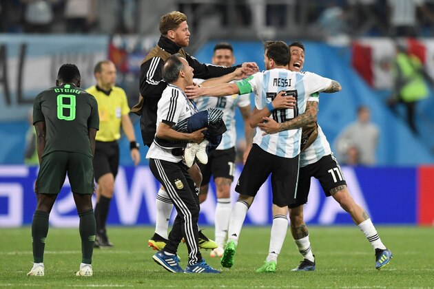 Argentina's forward Lionel Messi (#10) celebrates with teammates after victory during the Russia 2018 World Cup Group D football match between Nigeria and Argentina at the Saint Petersburg Stadium in Saint Petersburg on June 26, 2018. (Photo by GABRIEL BOUYS / AFP) / RESTRICTED TO EDITORIAL USE - NO MOBILE PUSH ALERTS/DOWNLOADS        (Photo credit should read GABRIEL BOUYS/AFP/Getty Images)