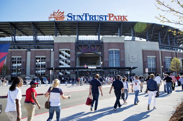 Fans head to SunTrust Park before the Atlanta Braves open their new ballpark in an exhibition spring training baseball game against the New York Yankees in Atlanta, Friday, March 31, 2017. (AP Photo/David Goldman)