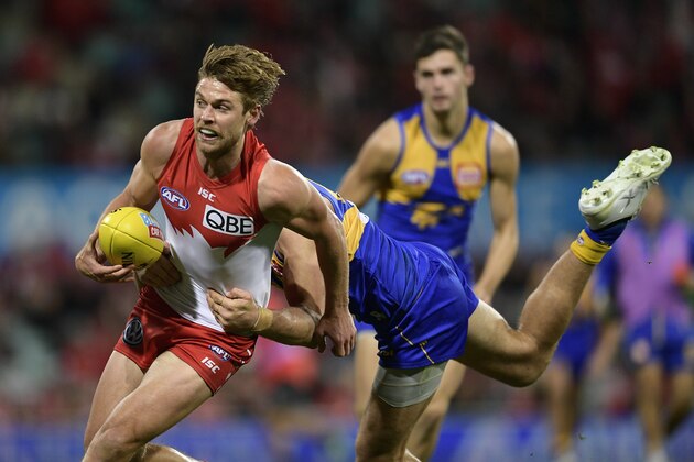 SYDNEY, AUSTRALIA - JUNE 15:  Dane Rampe of the Swans is tackled during the round 13 AFL match between the Sydney Swans and the West Coast Eagles at Sydney Cricket Ground on June 15, 2018 in Sydney, Australia.  (Photo by Brett Hemmings/Getty Images)