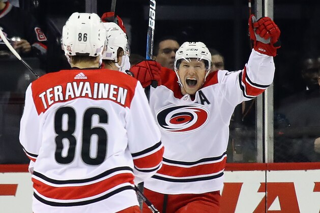 NEW YORK, NY - NOVEMBER 16: Jeff Skinner #53 of the Carolina Hurricanes celebrates a second period goal by Noah Hanifin #5 against Thomas Greiss #1 of the New York Islanders at the Barclays Center on November 16, 2017 in the Brooklyn borough of New York City.  (Photo by Bruce Bennett/Getty Images)