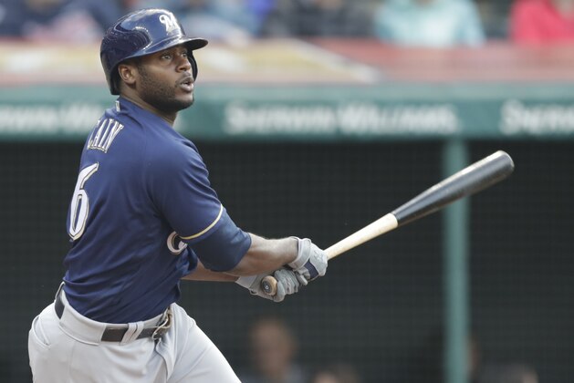 Milwaukee Brewers' Lorenzo Cain watches his RBI single off Cleveland Indians starting pitcher Corey Kluber in the third inning of a baseball game Tuesday, June 5, 2018, in Cleveland. (AP Photo/Tony Dejak)