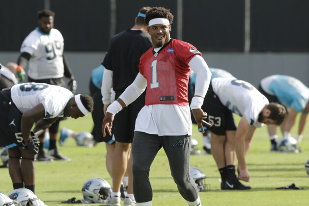 Carolina Panthers' Cam Newton (1) jokes with coaches and players during the NFL football team's practice in Charlotte, N.C., Thursday, June 14, 2018. (AP Photo/Chuck Burton) Carolina Panthers' Cam Newton (1) jokes with coaches and players during the NFL football team's practice in Charlotte, N.C., Thursday, June 14, 2018. (AP Photo/Chuck Burton)
