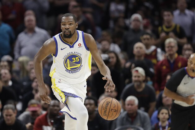 Golden State Warriors' Kevin Durant dribbles in the first half of Game 3 of basketball's NBA Finals against the Cleveland Cavaliers, Wednesday, June 6, 2018, in Cleveland. (AP Photo/Tony Dejak)
