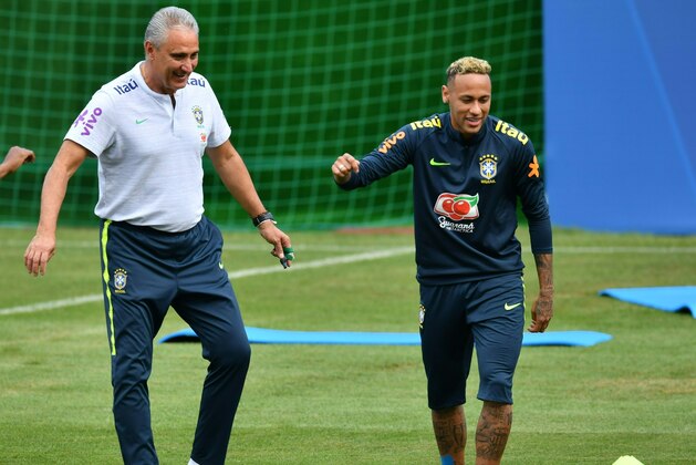 Brazil's coach Tite (L) and Brazil's forward Neymar are seen during a training session of Brazil national football team at Yug Sport Stadium, in Sochi, on June 19, 2018, ahead of the Russia 2018 World Cup football tournament. (Photo by Nelson Almeida / AFP)        (Photo credit should read NELSON ALMEIDA/AFP/Getty Images)